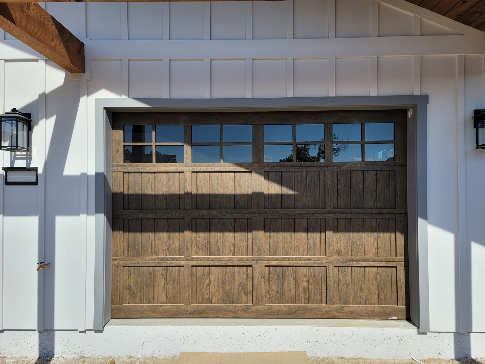 Wood-look sectional garage door on a Central Coast home