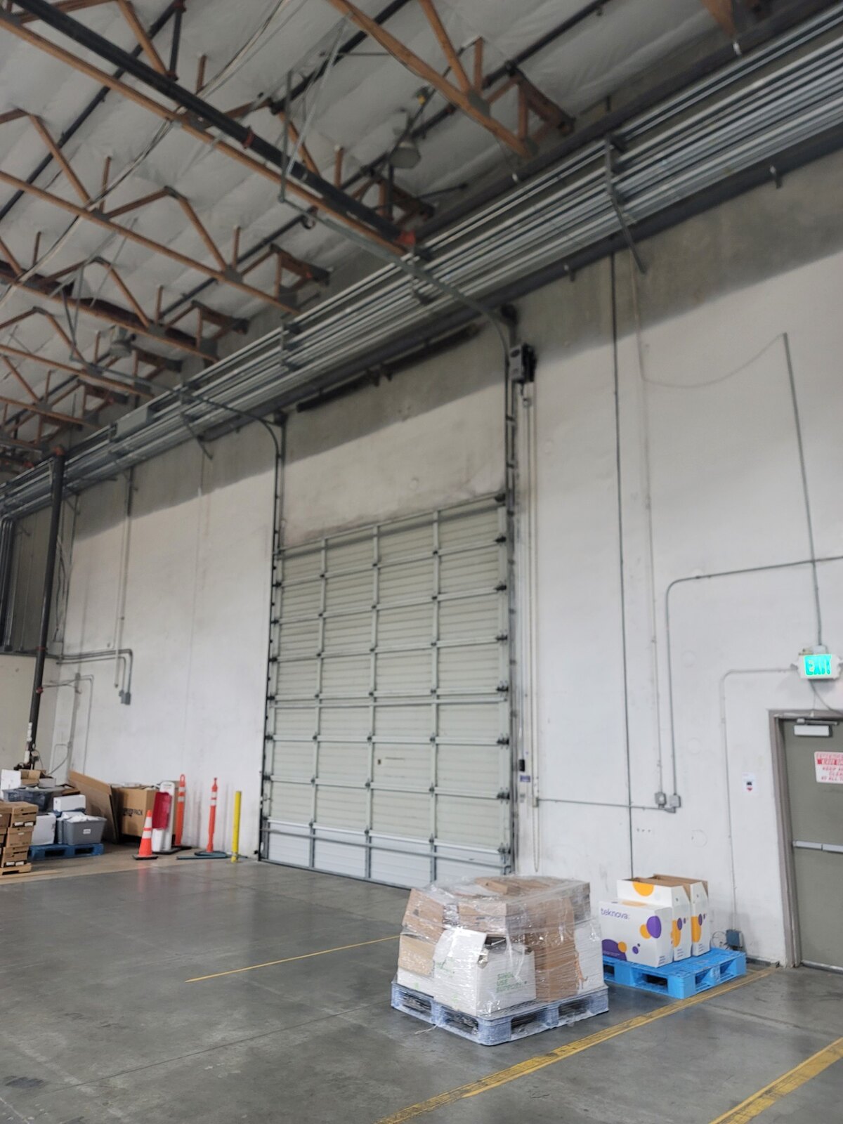 Tall commercial sectional overhead door, interior view