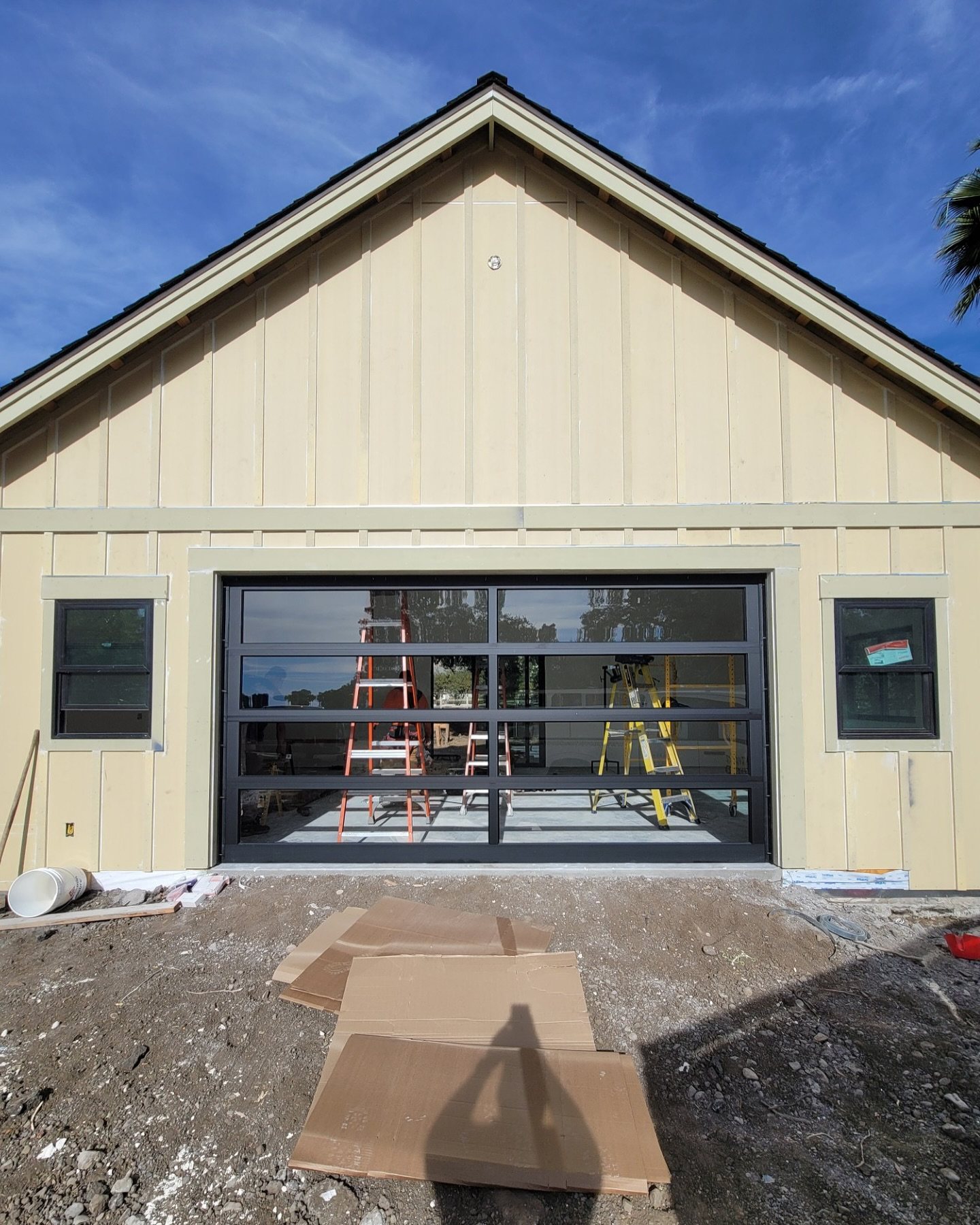 Home with a newly installed sectional garage door