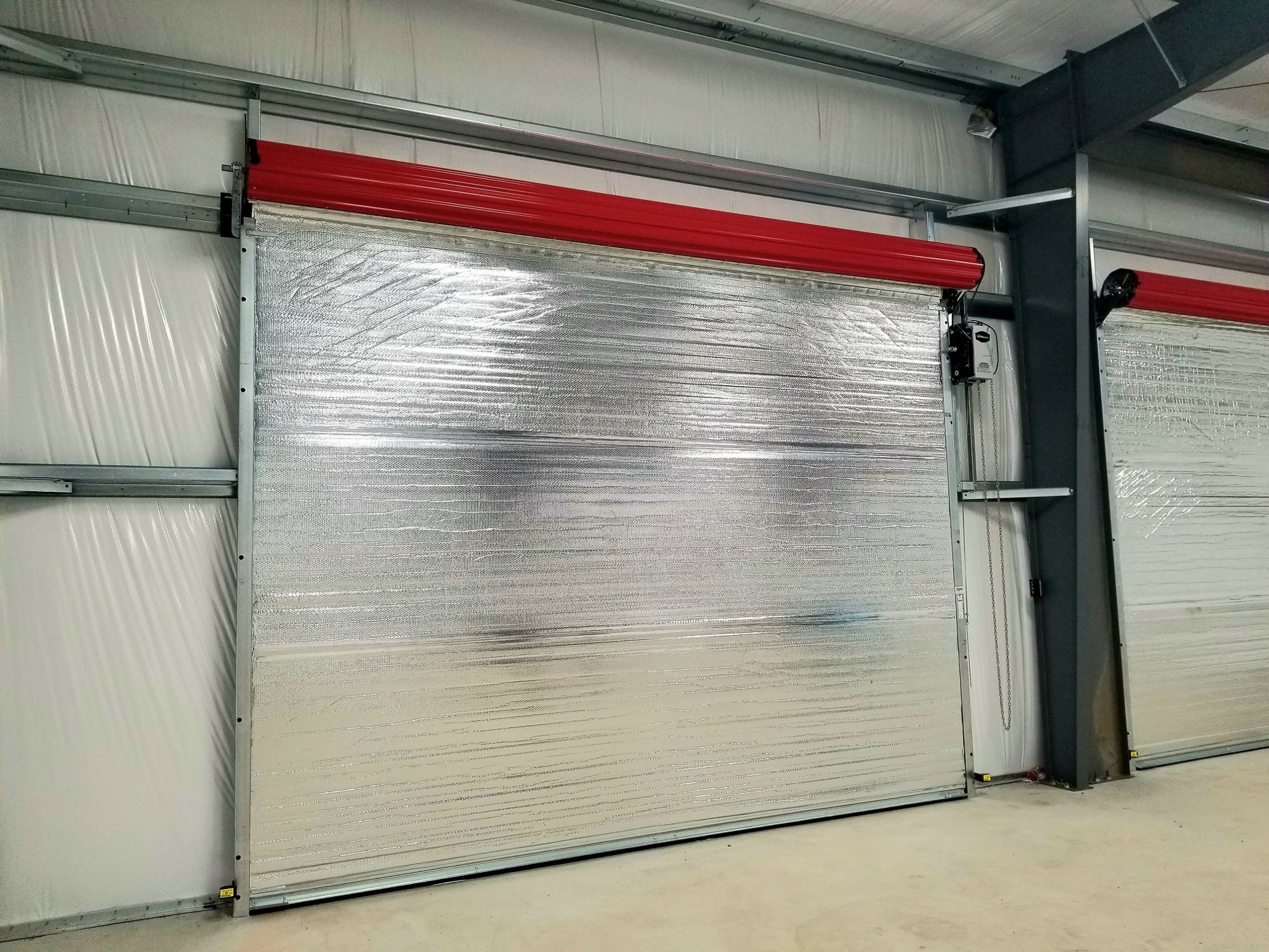 Industrial facility with red rolling-steel doors