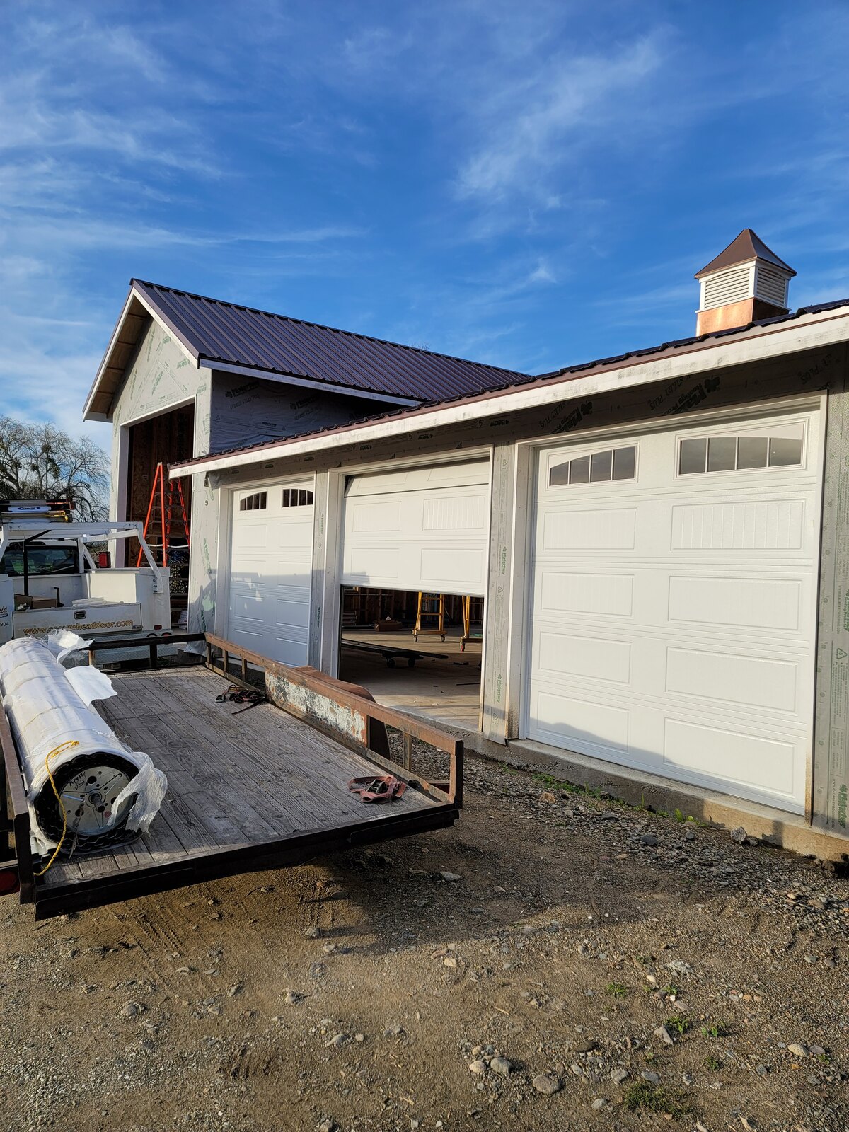 Wood-look carriage garage doors on a new-construction home