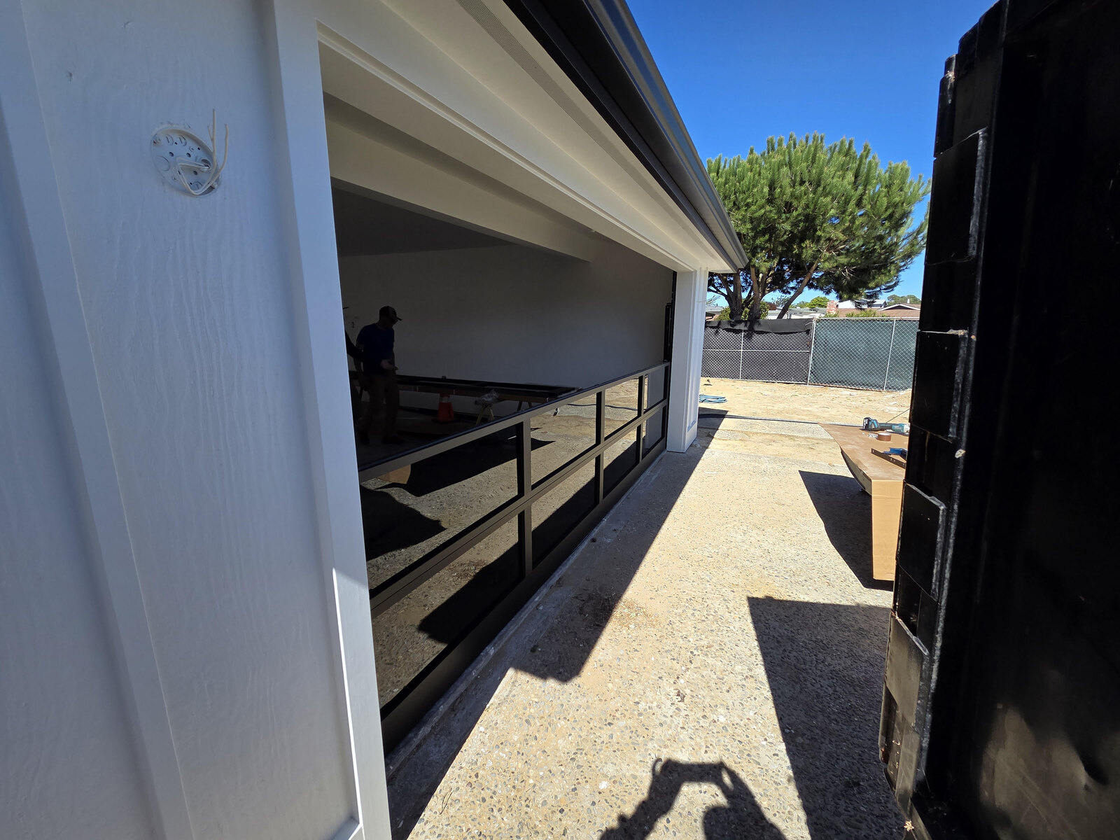 Modern flat-panel garage door on a contemporary home