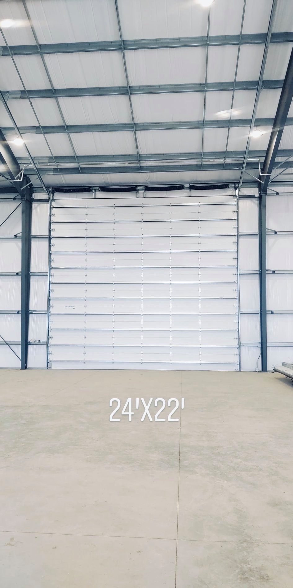 Large commercial-industrial sectional door, clean interior