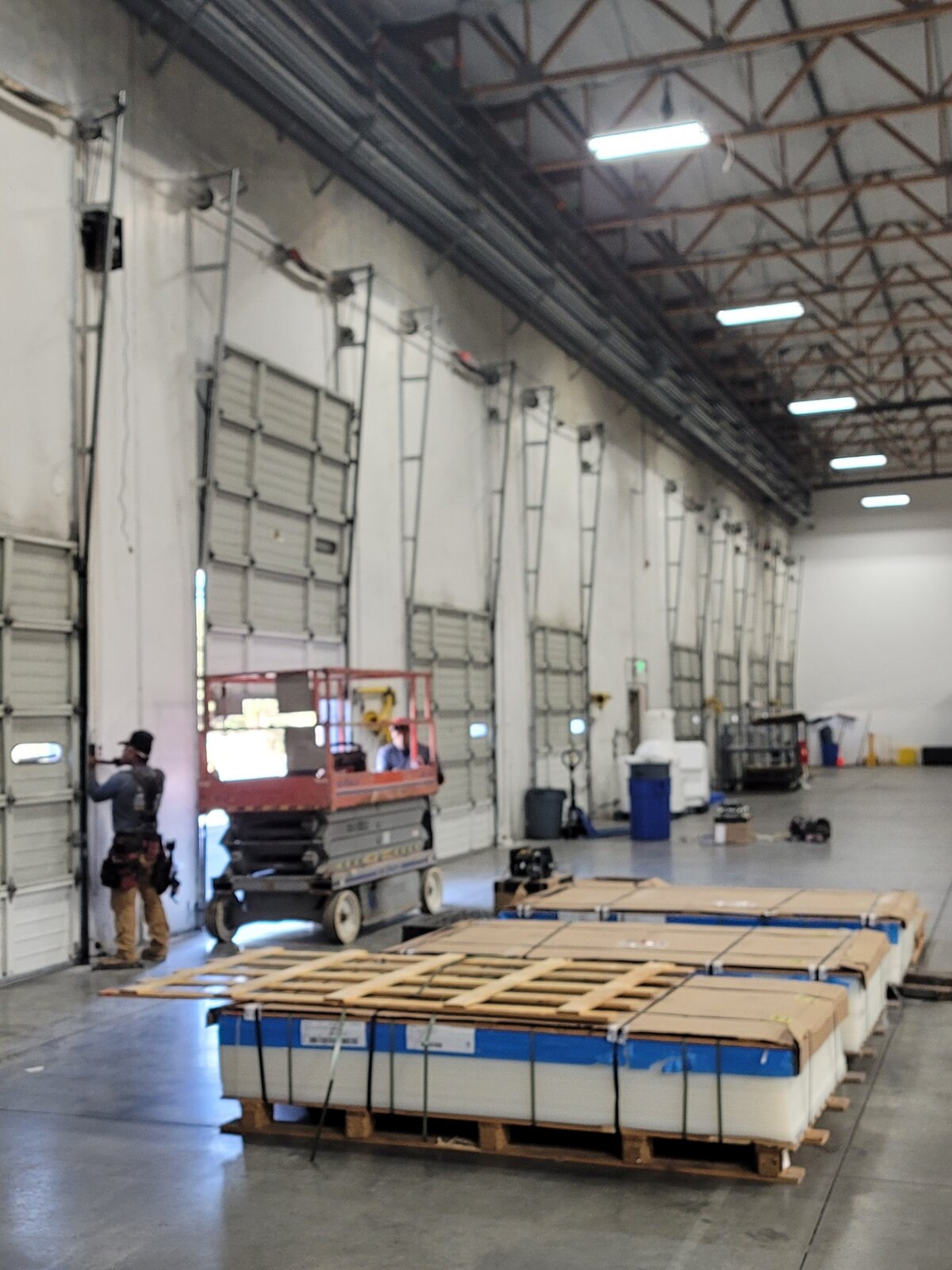 Commercial overhead door installation in progress