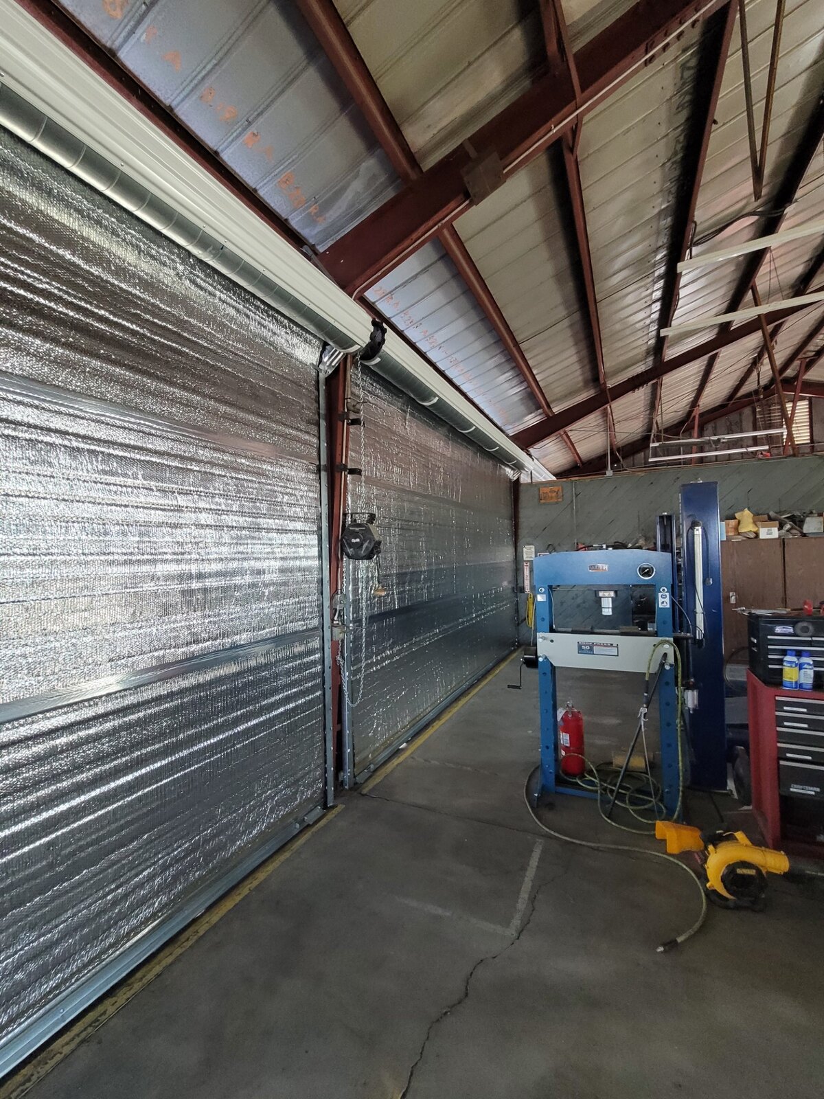 Installing a rolling steel door in an agricultural building