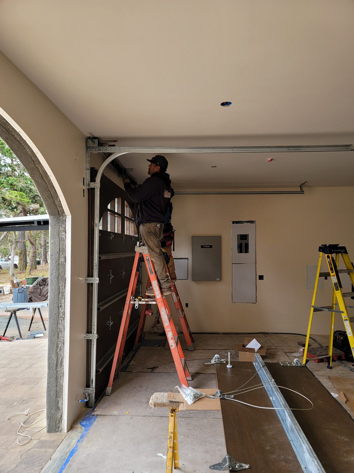 California Overhead Door technician installing a new residential garage door