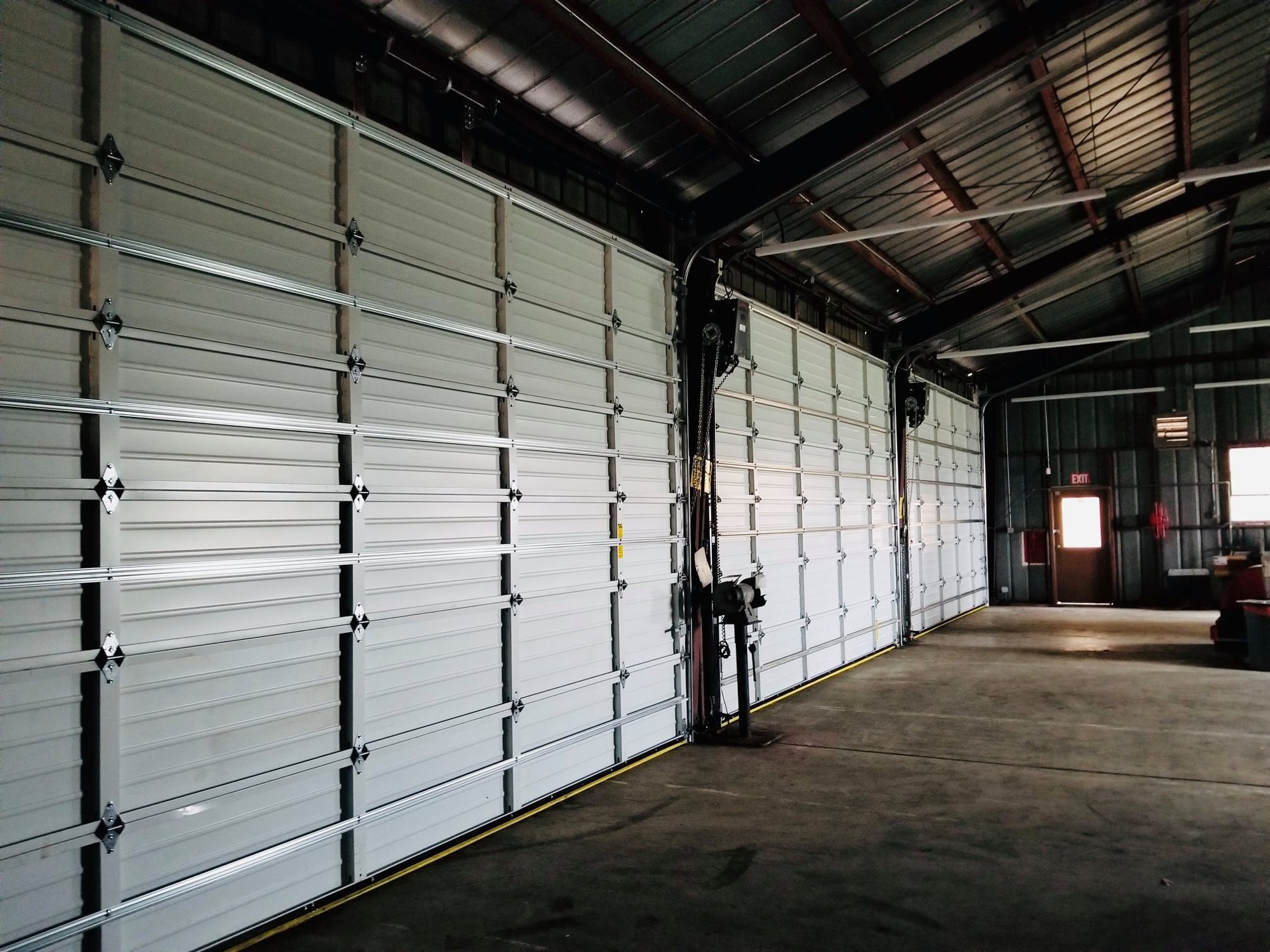 Warehouse interior lined with overhead doors