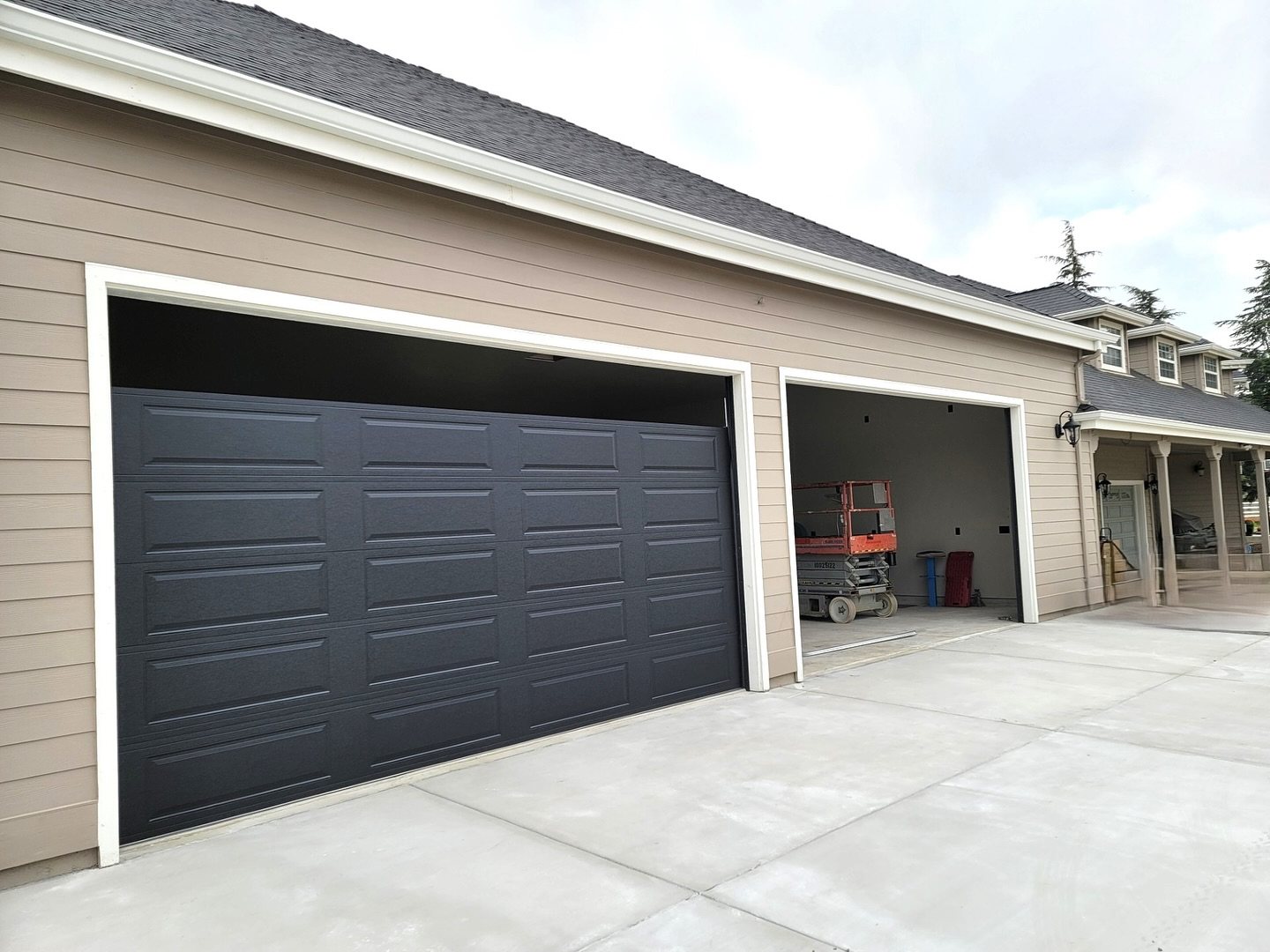 Newly installed three-car residential garage doors