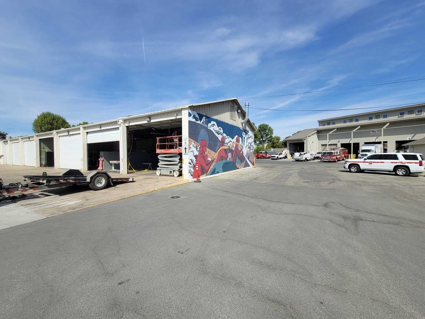 Commercial building exterior with glass overhead doors